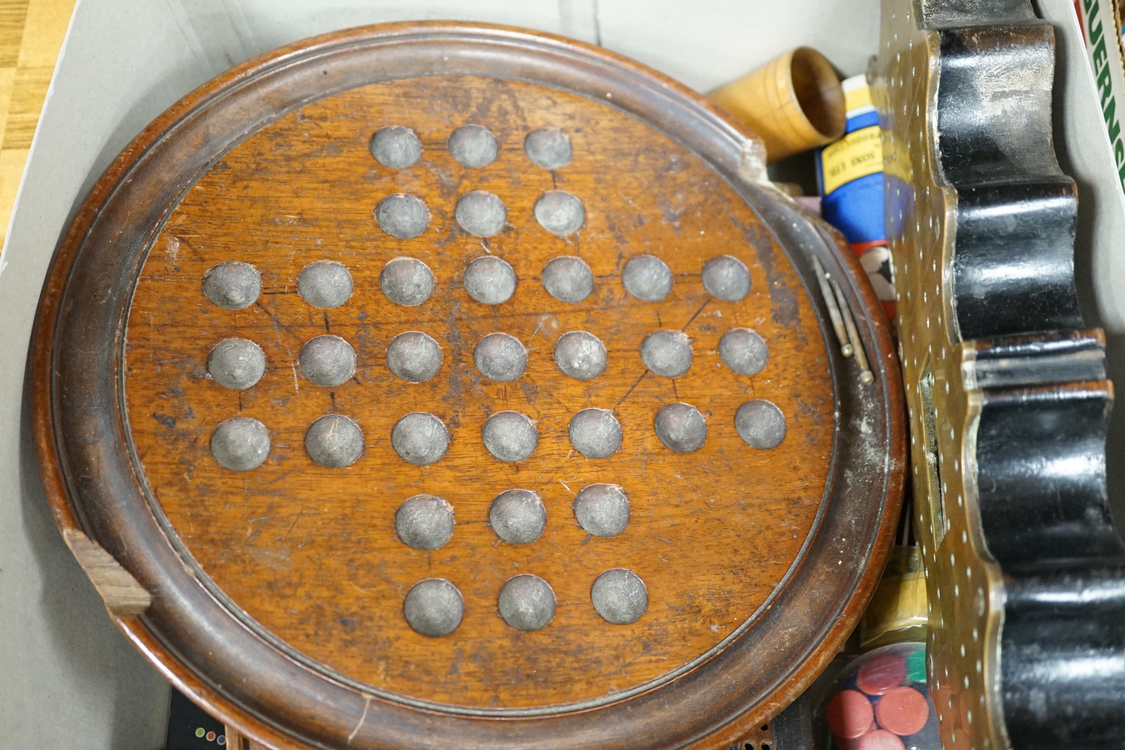 A selection of various games, to include a cribbage board, cards etc.